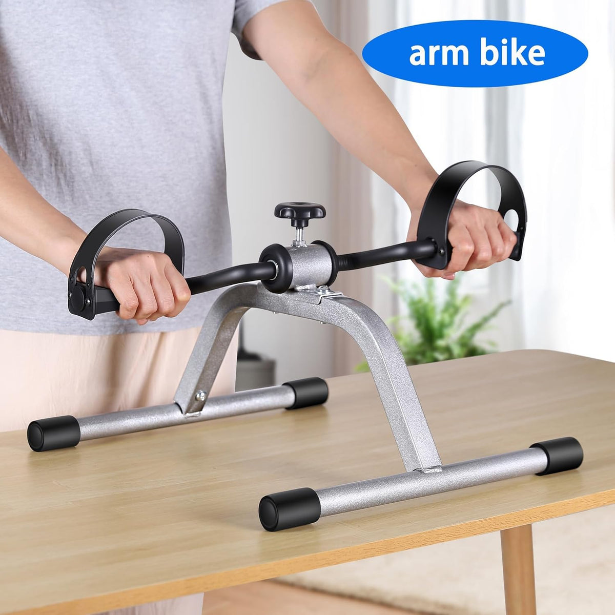 Arm bike panel: the mini exercise bike used on a table top with both hands.