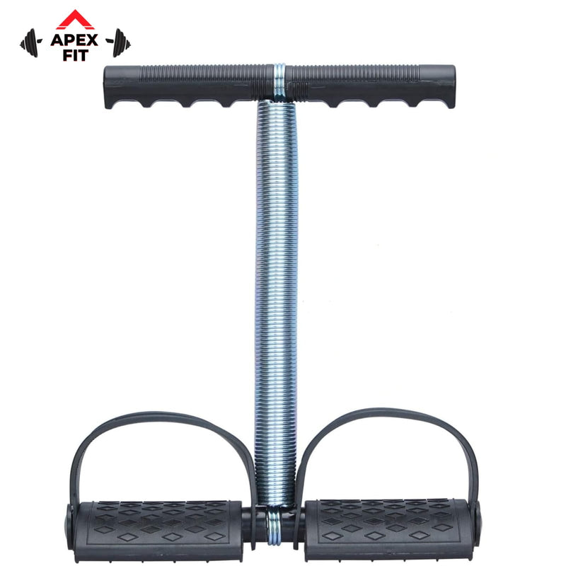 Apex Fit single spring tummy trimmer with a heavy steel spring, a moulded foam handle and two textured non-slip foot pedals.